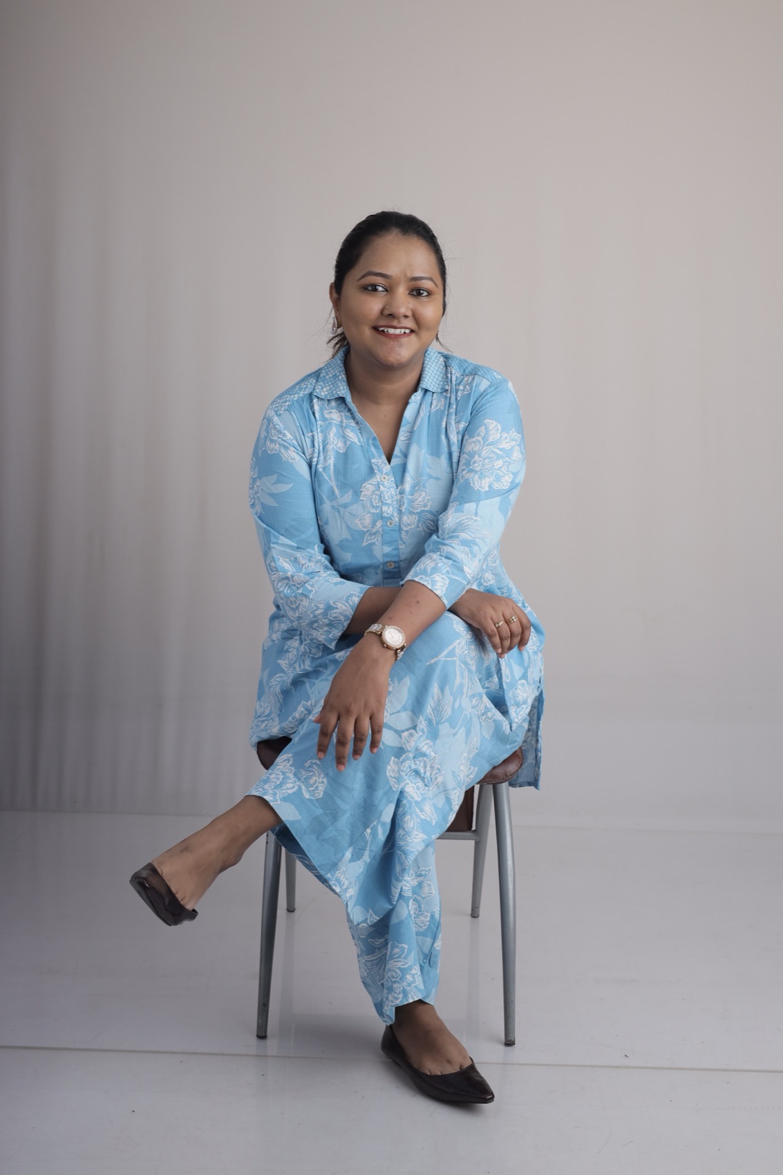 Rahath Afroz seated